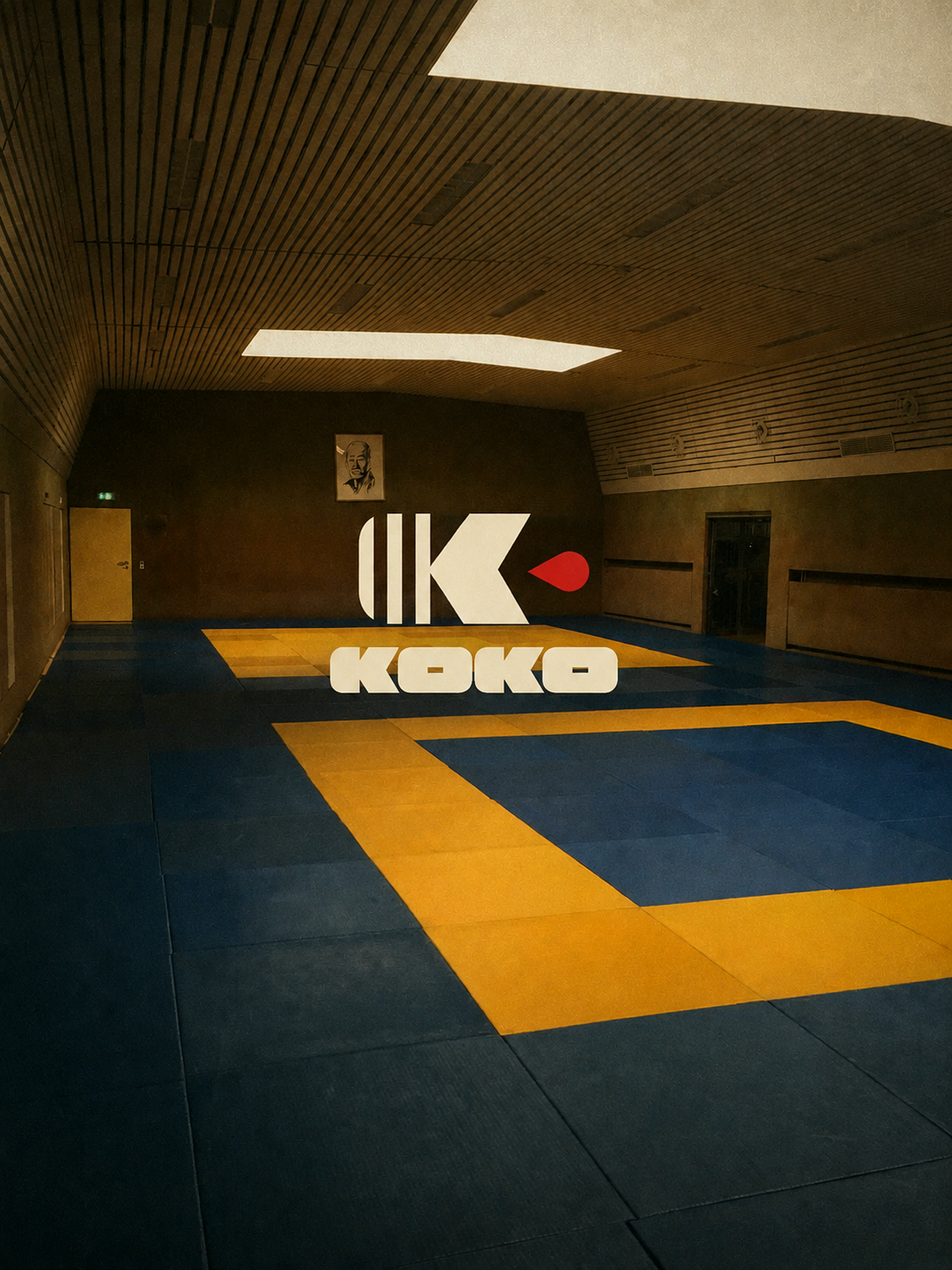 An empty jiu-jitsu mat waiting under the lights